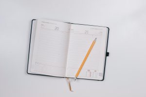 Open Planner With Pencil